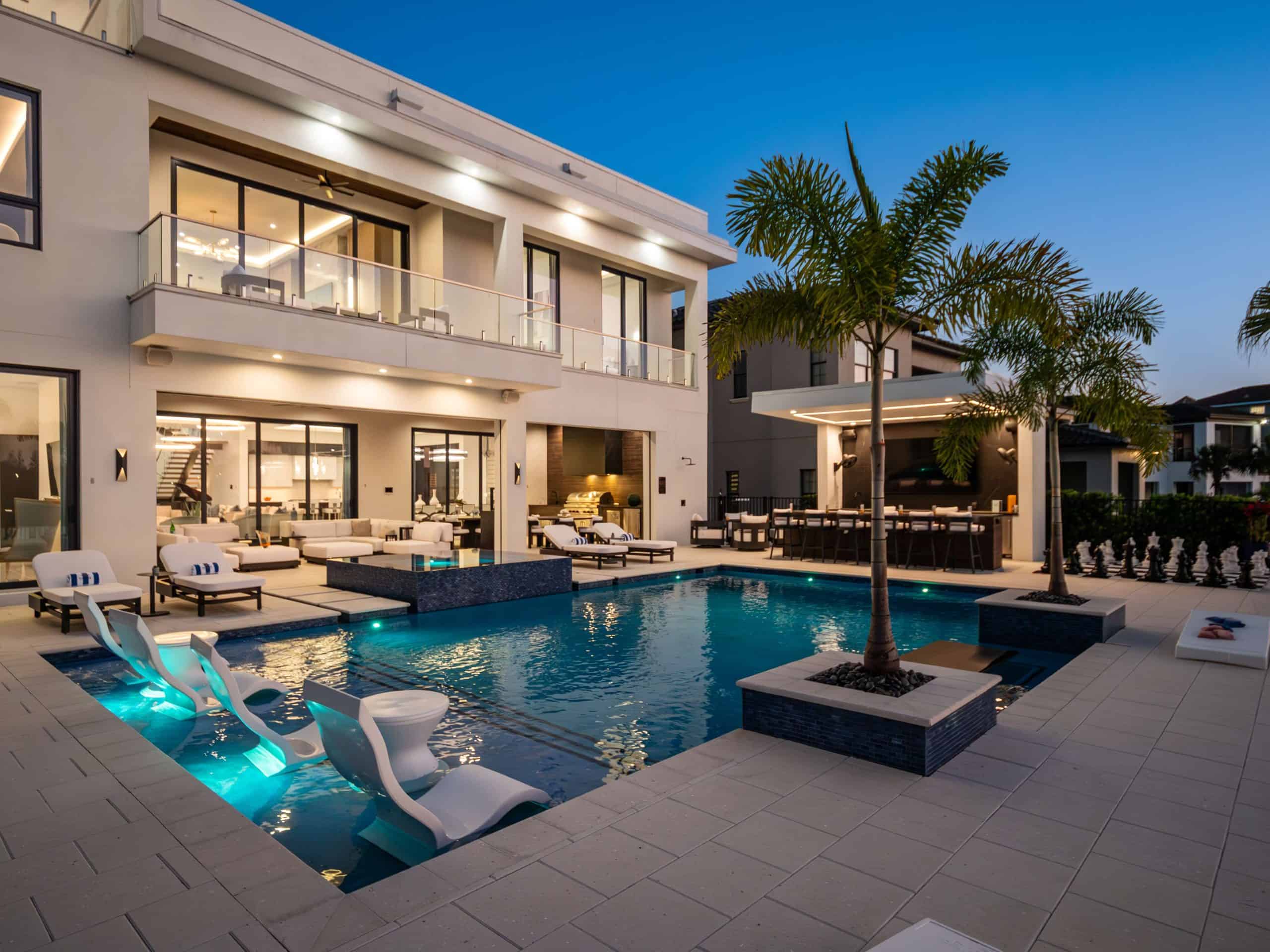 Luxury modern backyard pool with seating and tropical landscaping in Historic Downtown, Winter Park FL