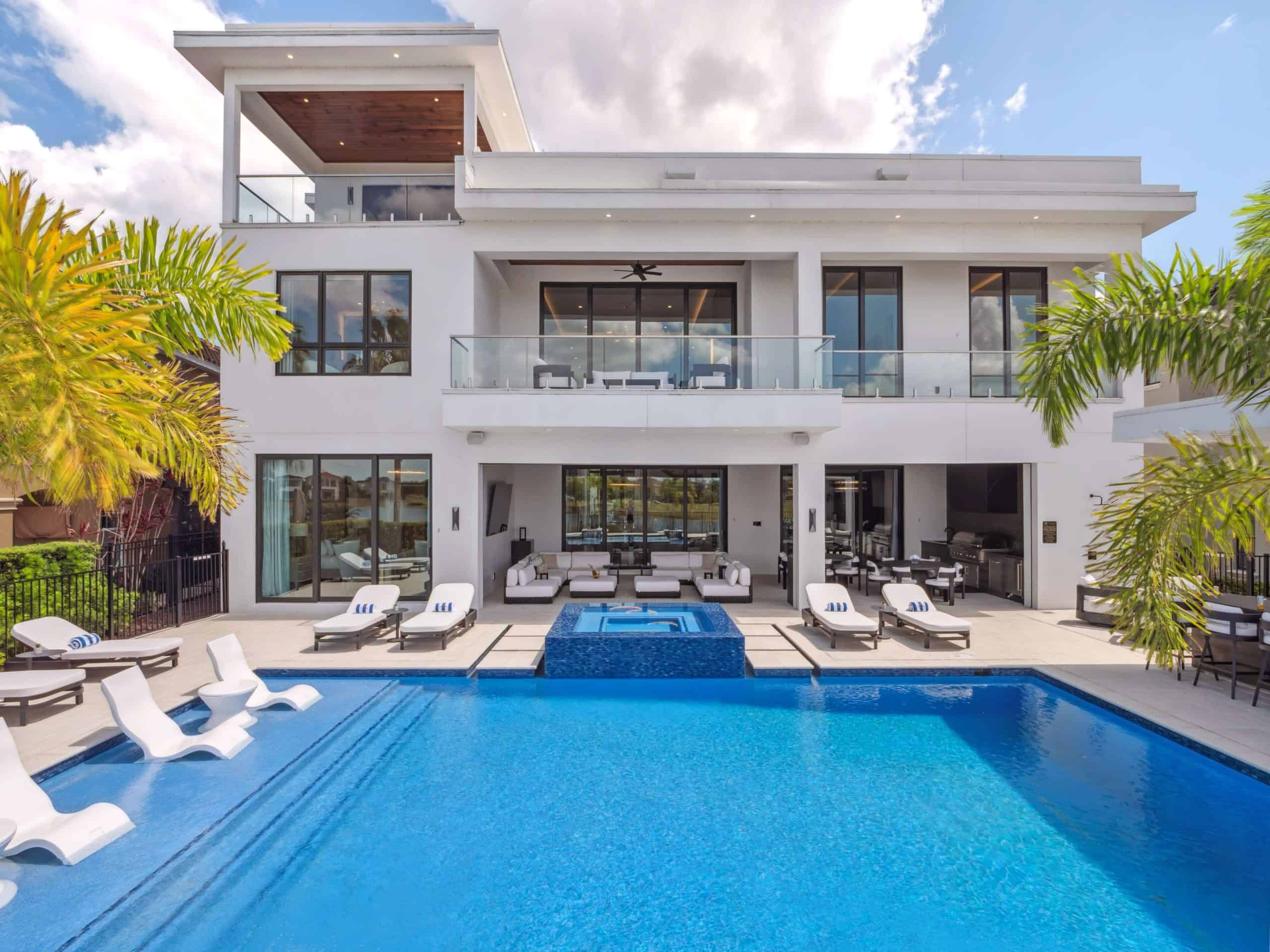 Modern outdoor poolside bar with lake views at sunset in Celebration, Osceola County FL