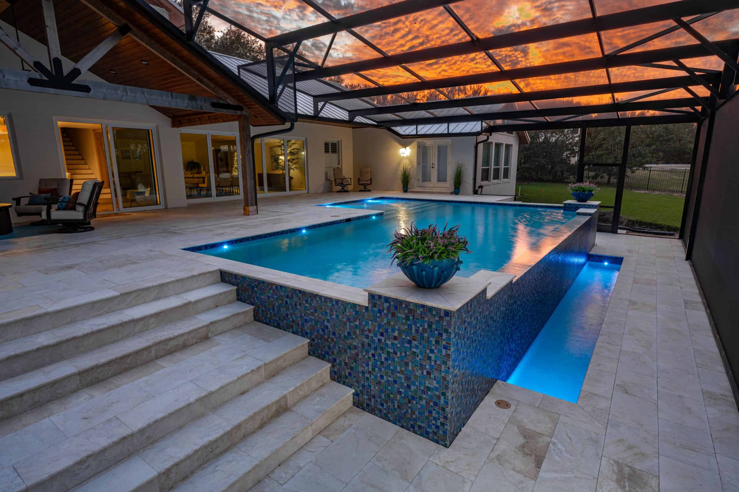 Luxurious backyard pool with infinity edge and modern lighting at sunset in Historic Downtown, Melbourne