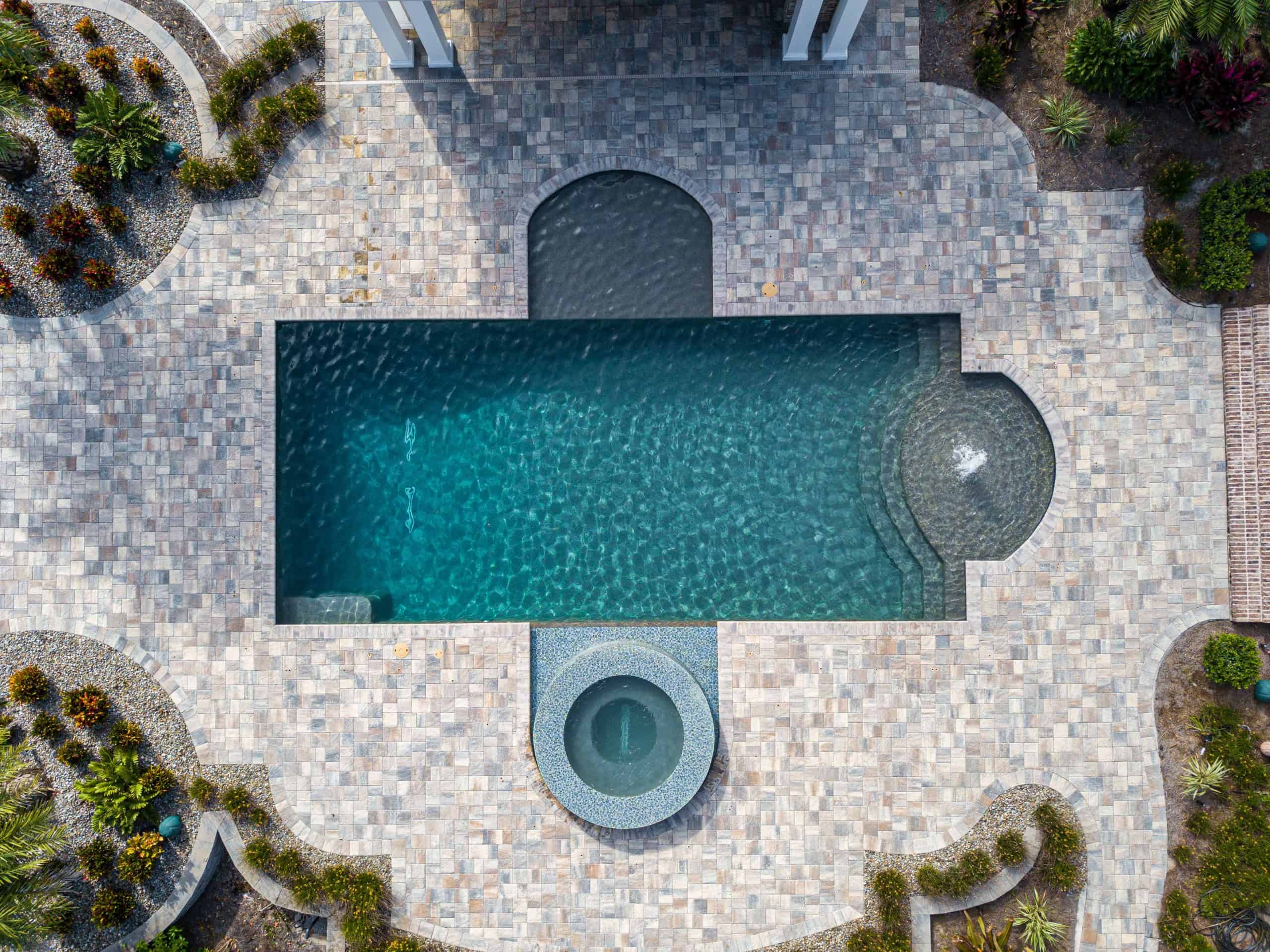 Faden Photography15 Luxury backyard pool with stone decking and landscaping from Southern Pool Designs