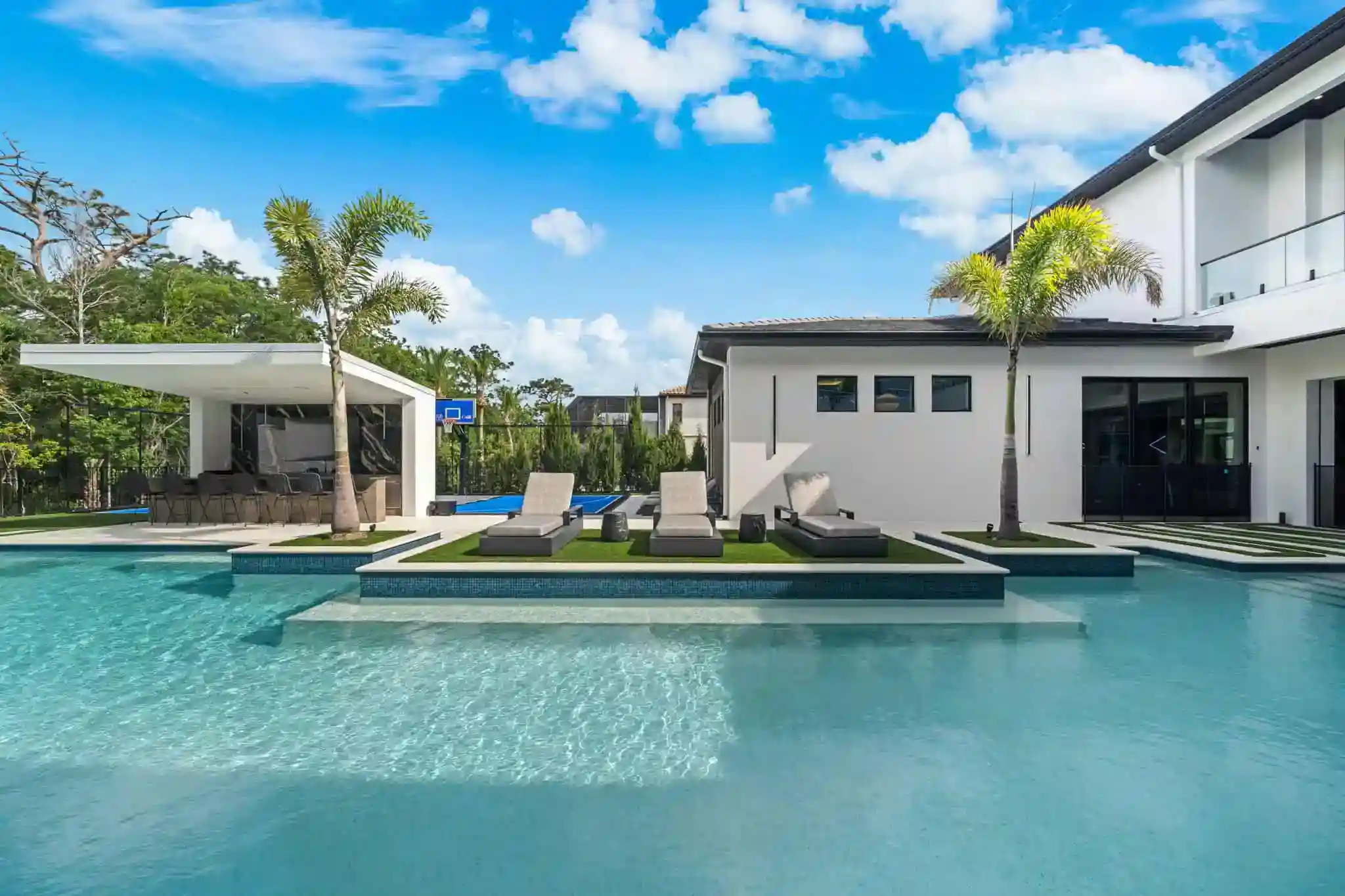 Modern backyard pool with spacious lounge area and outdoor living space in Longwood, Seminole County FL