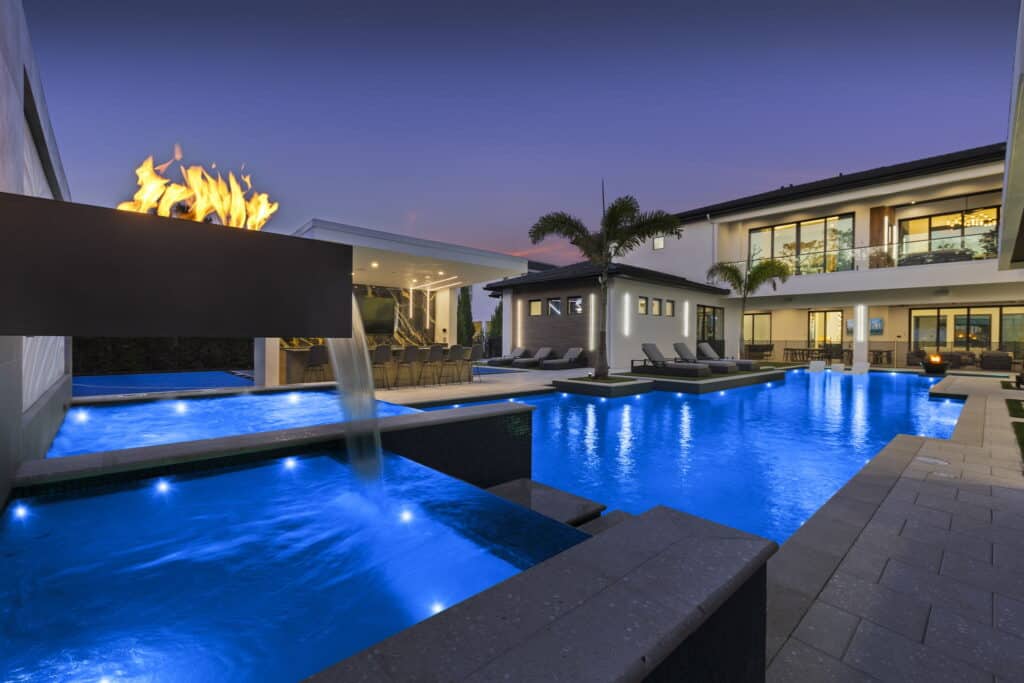 Luxury pool design with a combined water and fire feature in Sanford, Florida