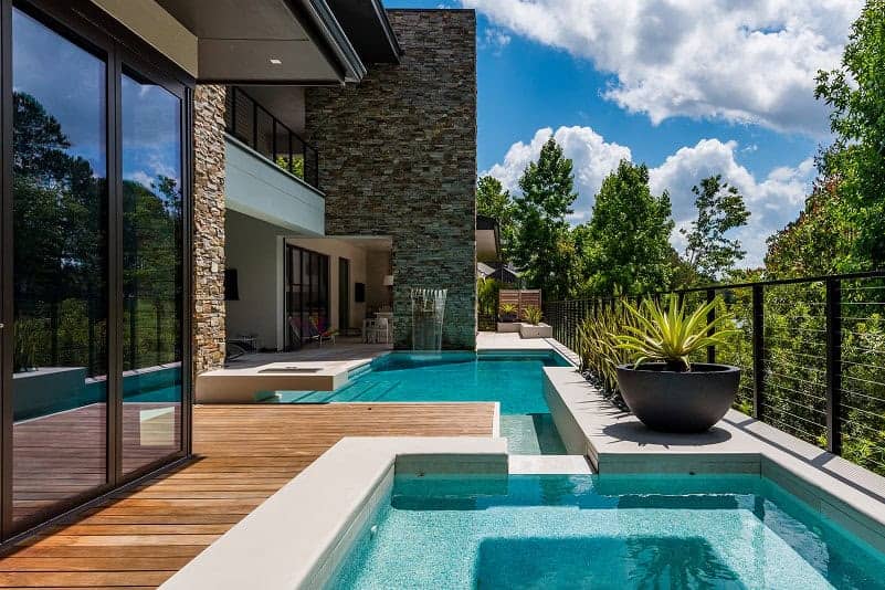 Resort style custom pool with sun shelf and spa