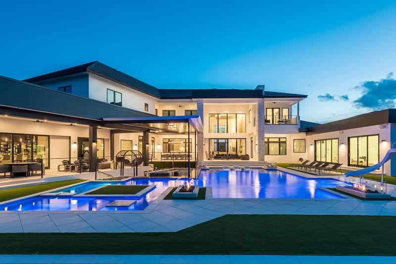 Luxury backyard pool with fire and water features