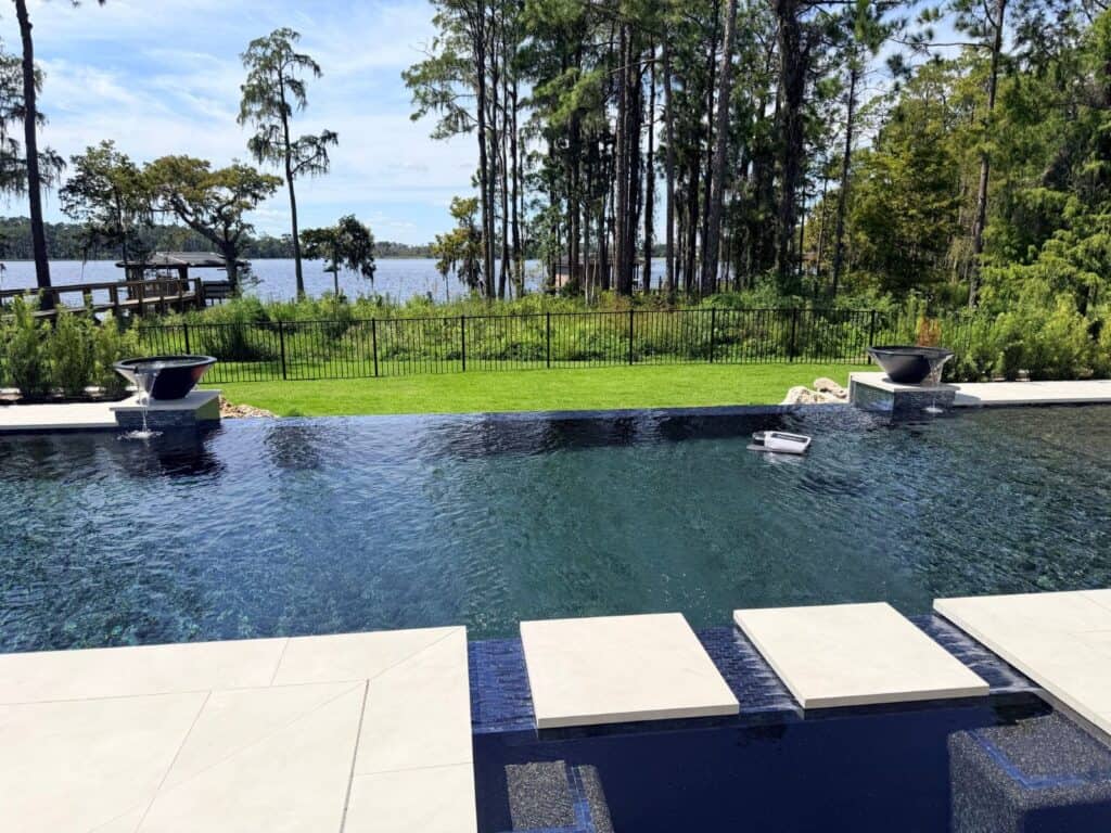 Lakefront luxury pool with water bowls and spillways in Lake Nona, Florida