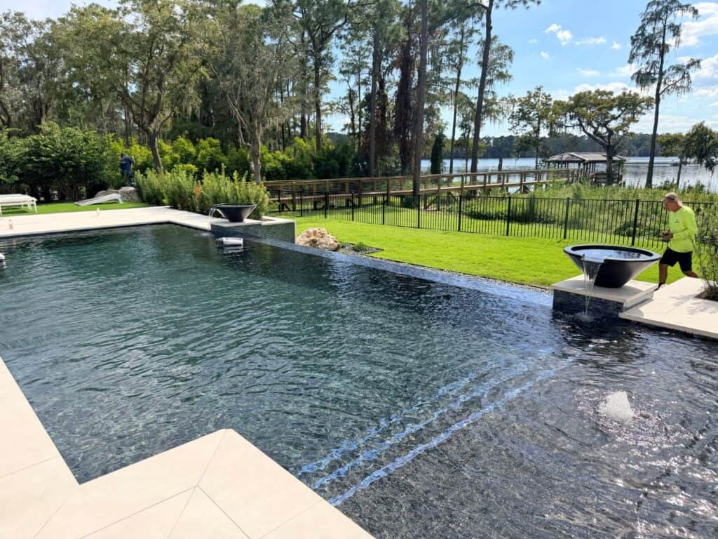 Luxury pool with fountain bowls overlooking the lake in Lake Nona, Florida