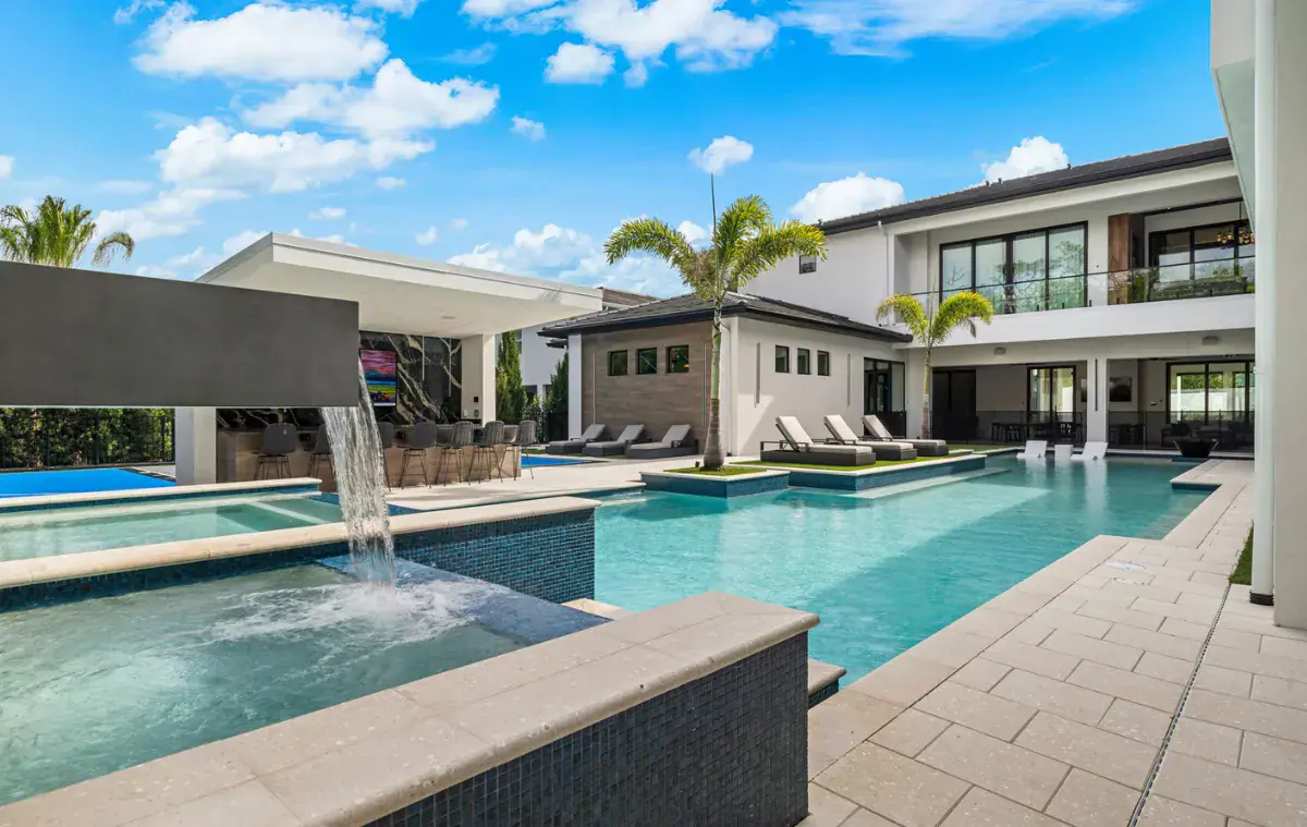 Outdoor pool with fountain, built by Southern Pool Designs